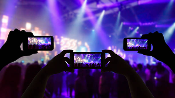 istock Take photo concert in front of stage 546018316