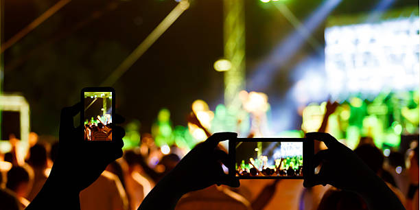 istock Take photo concert in front of stage 546018420