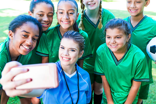 istock Soccer coach takes selfie with team after game 546019108