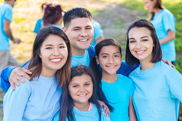 istock Hispanic family helps with community beautification 546019578