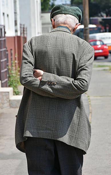istock Old man walks on the street 546020618