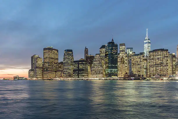 View of Manhattan's Financial district at dusk from the Brooklyn Bridge Park, New York City