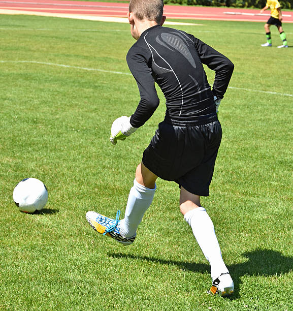 istock Young goalkeeper kicks the ball 546023210