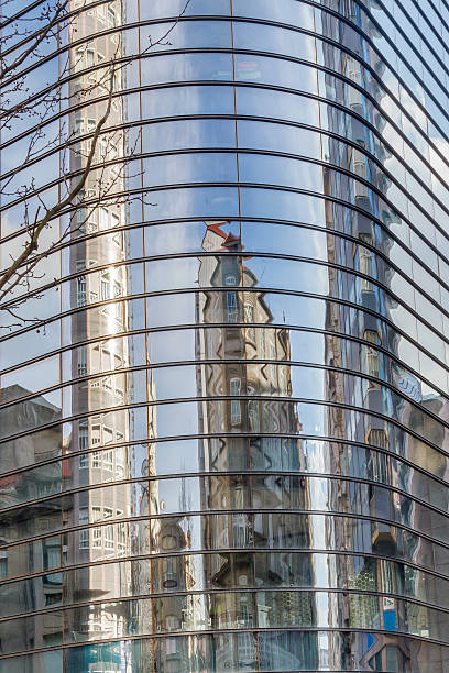 istock Buildings reflected in a glass building 546025244