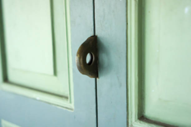 istock Green and blue wooden door with lock. 546026912