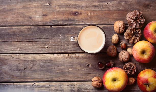 istock apples, fir-cones, cup of coffee and nuts 546027542