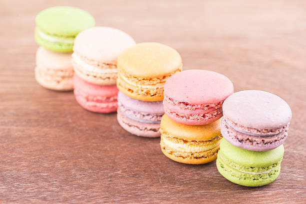 istock Colorful macarons stacked up on a wooden table 546164082