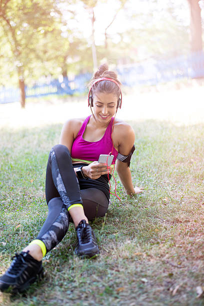 istock Happy woman resting after running 546166418