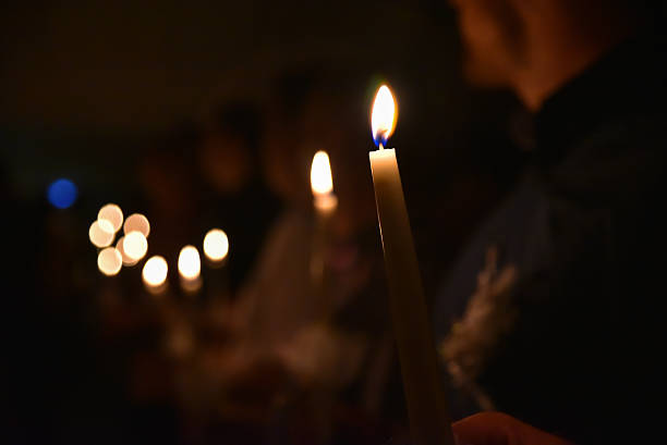 istock People hold Candles in the dark 546166852