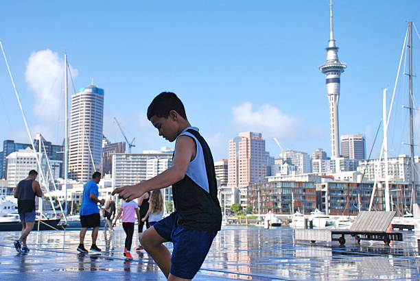 istock Polynesian Boy playing Football 546168152