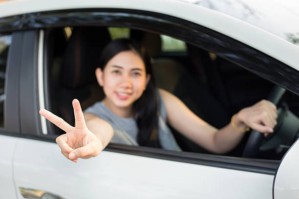 istock Woman drives a car and smiling 546170034