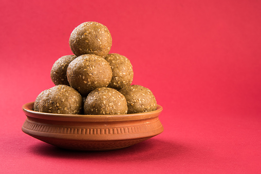 indian sesame sweet or tilgul laddu, made up of jaggery and sesame seeds, hand made, round, indian sweet prepared in Makar Sankranti