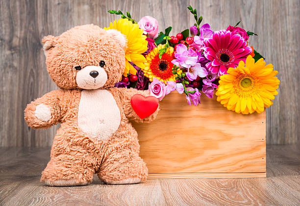 istock Bunch of flowers and a teddy bear 546171368