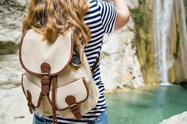 istock Young hipster woman standing  in wilderness 546173662