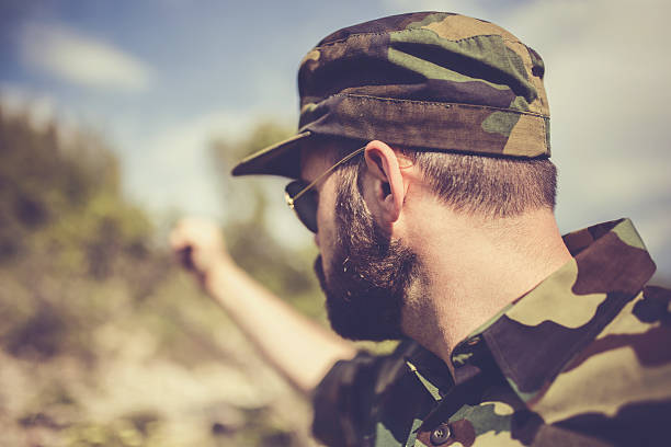 istock Army soldier with raised fist 546174678