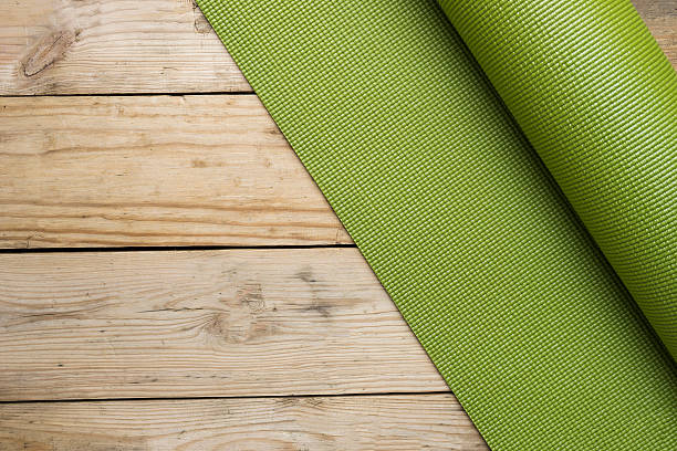 istock yoga mat on the wood table 546174734