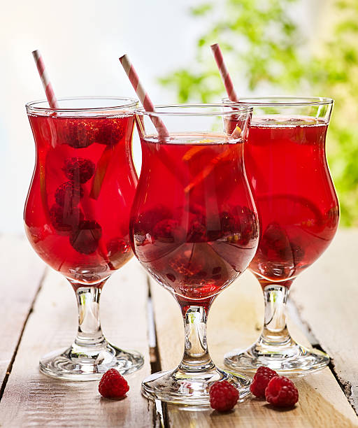 istock On wooden is ice cold beverage glass with berries cocktail . 546175932