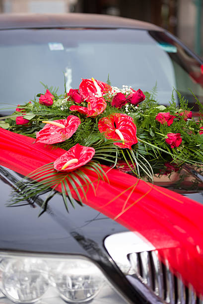 istock Limousine with red orchids flower 546177148