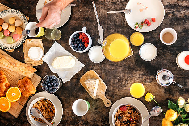 istock overhead view on breakfast table with macarons, baguette and fruits 546179770