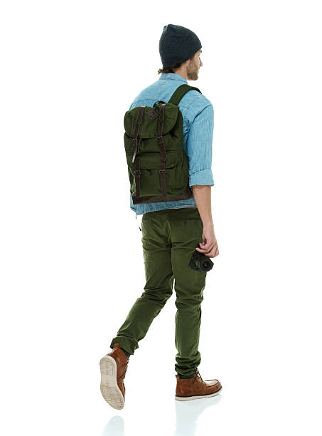 istock Rear view of photographer walking 546179948