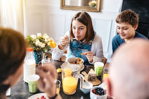 istock french family having breakfast together 546180038