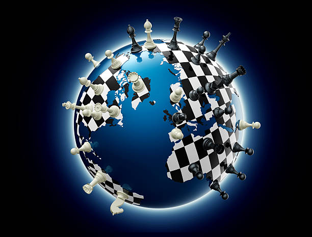 symbol of geopolitics the world globe with chess pieces stock photo