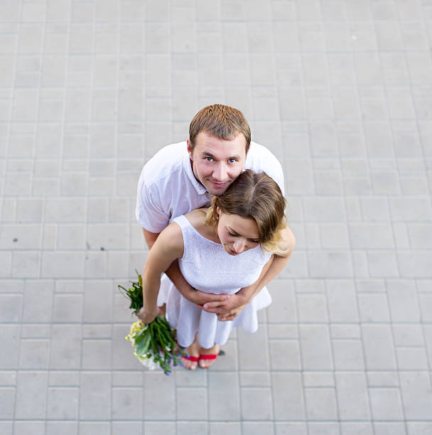 istock The young groom gently embraces the bride. 546181652