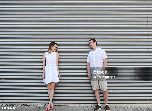 Beautiful Couple Costs At A Motley Wall Stock Photo - Download Image Now - Adult, Arts Culture and Entertainment, Beautiful People