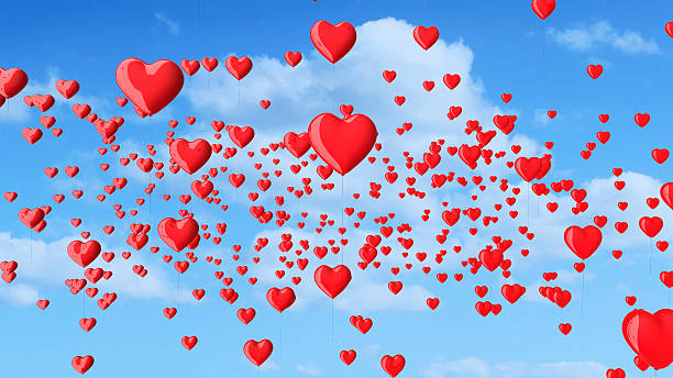 istock red heart shaped balloons in the blue sky with clouds. 546183008