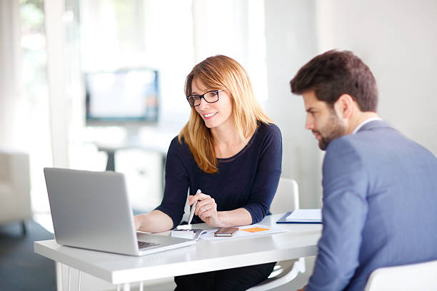 Financial advisor with client stock photo