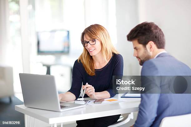 Financial Advisor With Client Stock Photo - Download Image Now - Financial Advisor, Customer, Bank - Financial Building