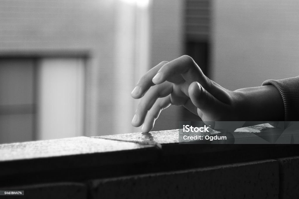 Finger tapping Kid's hand with fingers tapping in black and white Tapping Stock Photo