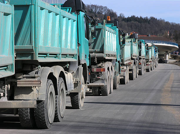 Trucks on road building