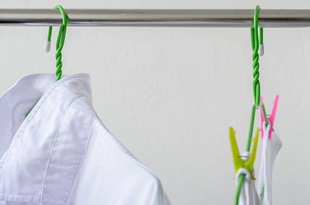 istock white shirts drying on a clothes line. 546191862