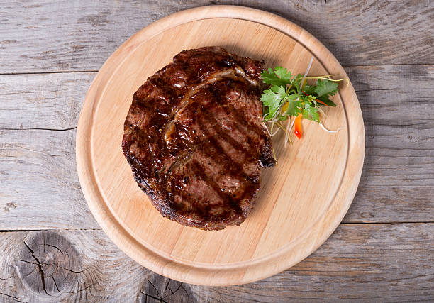 istock Prepared beef steak on a wooden board 546191912