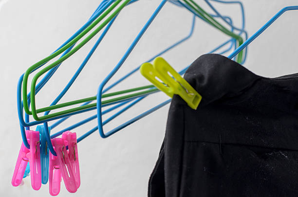 istock black trousers and hanger drying on a clothes line.. 546192064