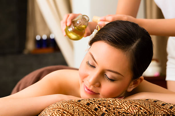 istock Chinese Woman at wellness massage with essential oils 546192564