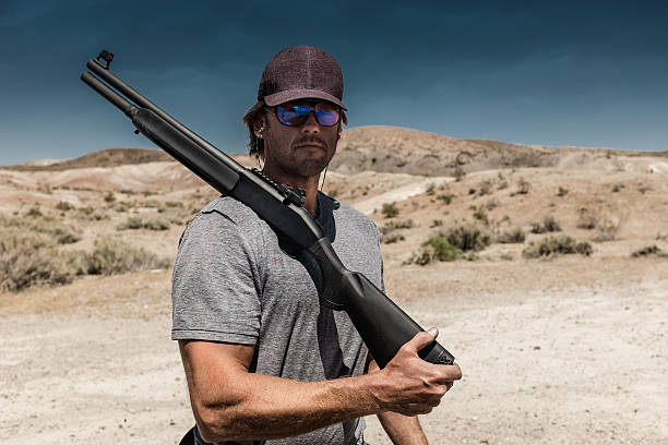 istock Man Shooting A 12 Gauge Shotgun 546193360
