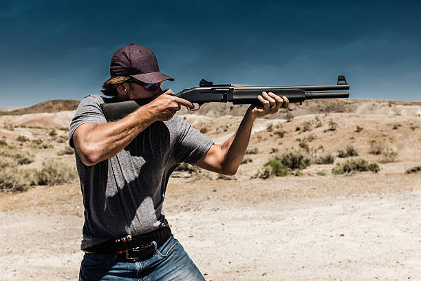 istock Man Shooting A 12 Gauge Shotgun 546193458