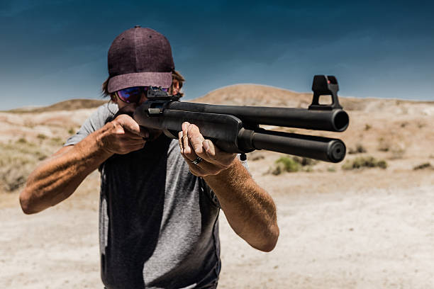 istock Man Shooting A 12 Gauge Shotgun 546193508