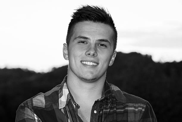 istock handsome young man portrait outdoor 546194470