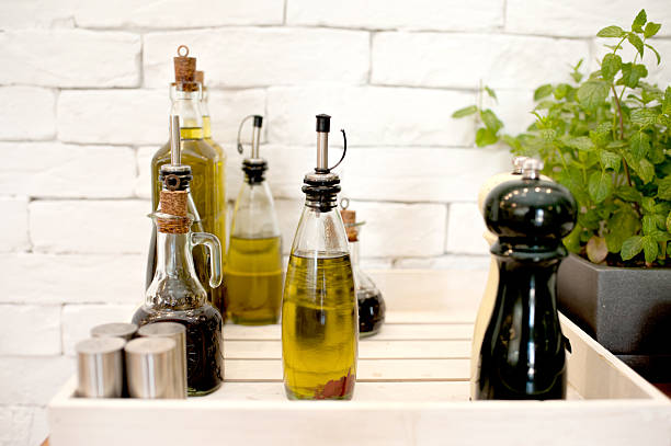 Set of olive, salt and pepper on the white brick background
