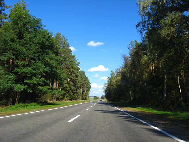 istock asphalted road and the blue sky 546195108