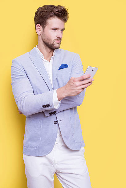 istock Handsome elegant man with a phone in his hand 546195160
