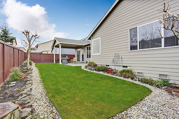 istock Backyard with sitting area, nice green lawn 546195328