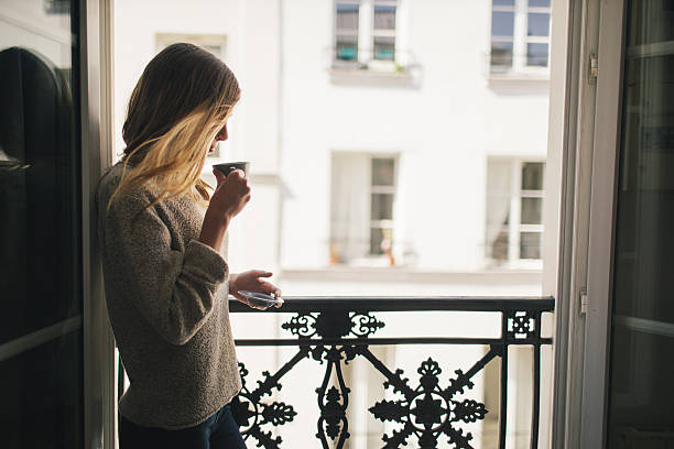istock Woman drinking coffee at the balcony 546195756