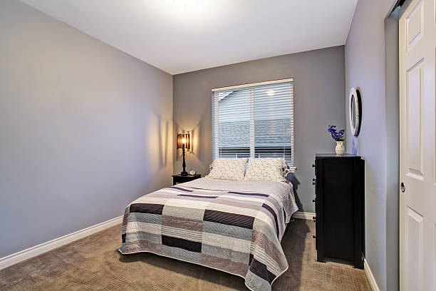 istock Gray simple bedroom with big bed, large window. 546195774