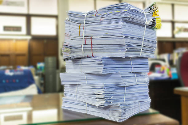 istock Stack of business report paper files with black clips 546196886