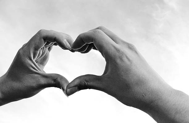 istock Guy hand in heart form love, monochrome 546197196