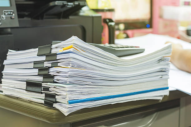 istock Stack of business report paper files with black clips 546197262